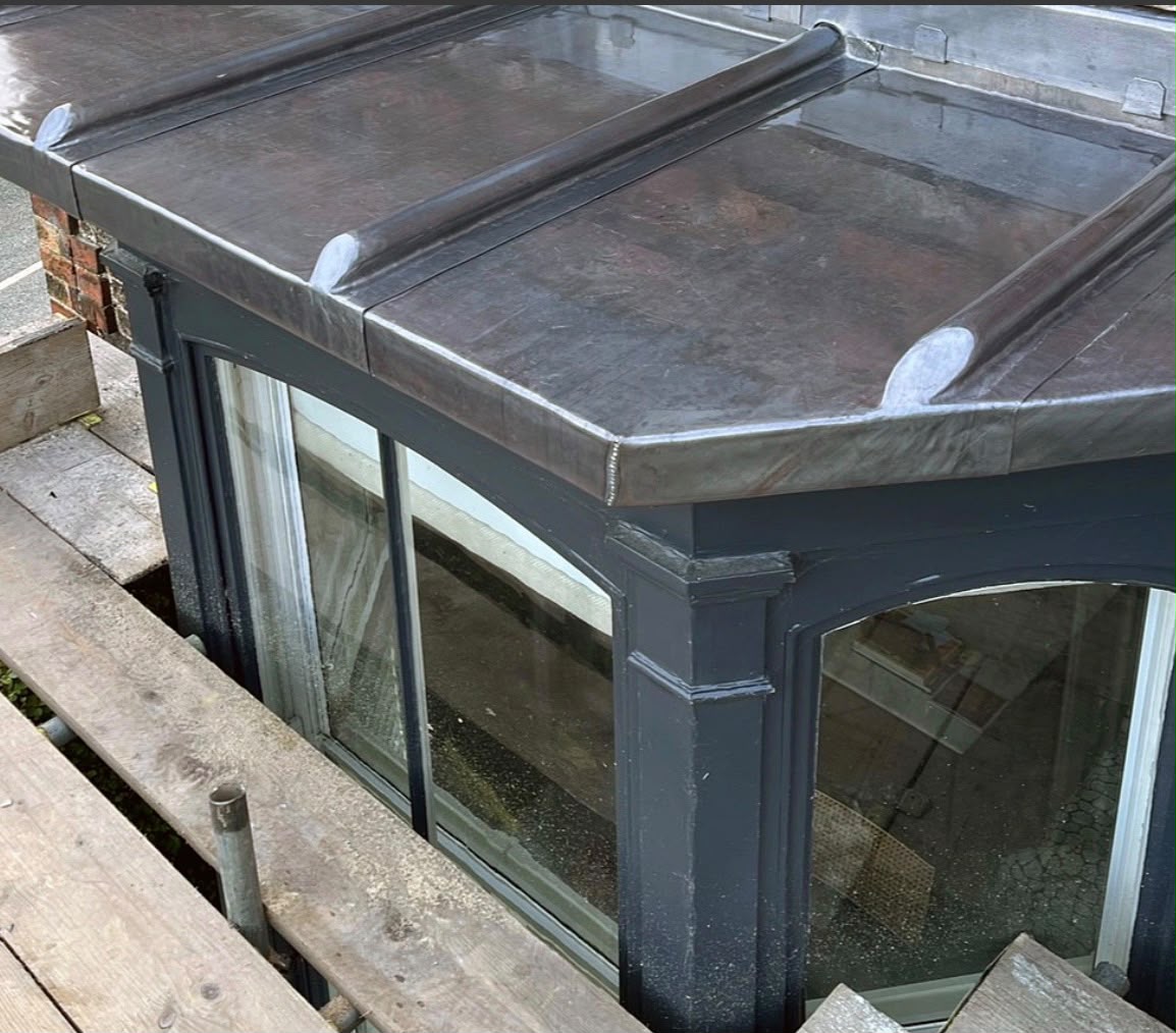 Lead flashing dressed over a bay window roof by Goliath Roofing
