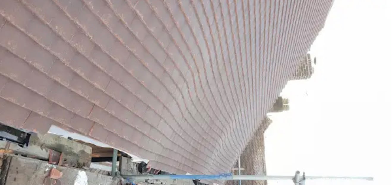 Section of finished red tile pitched roof